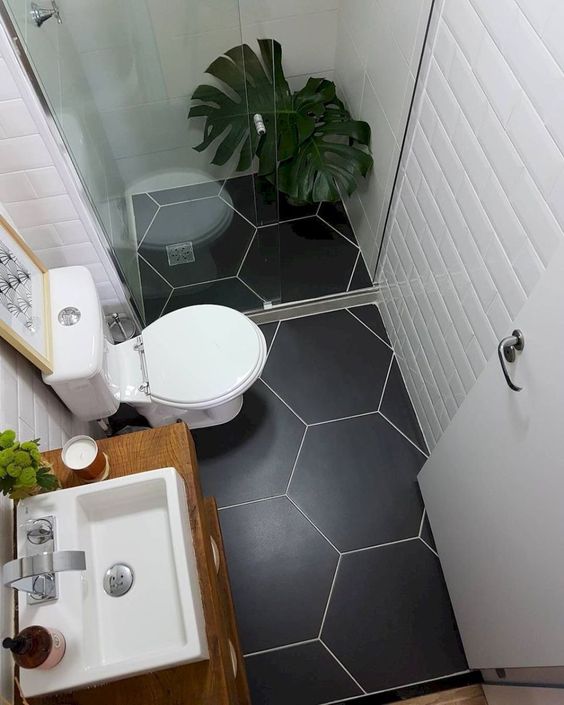 A small shower space in a small bathroom